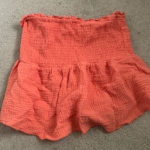 orange strapless top